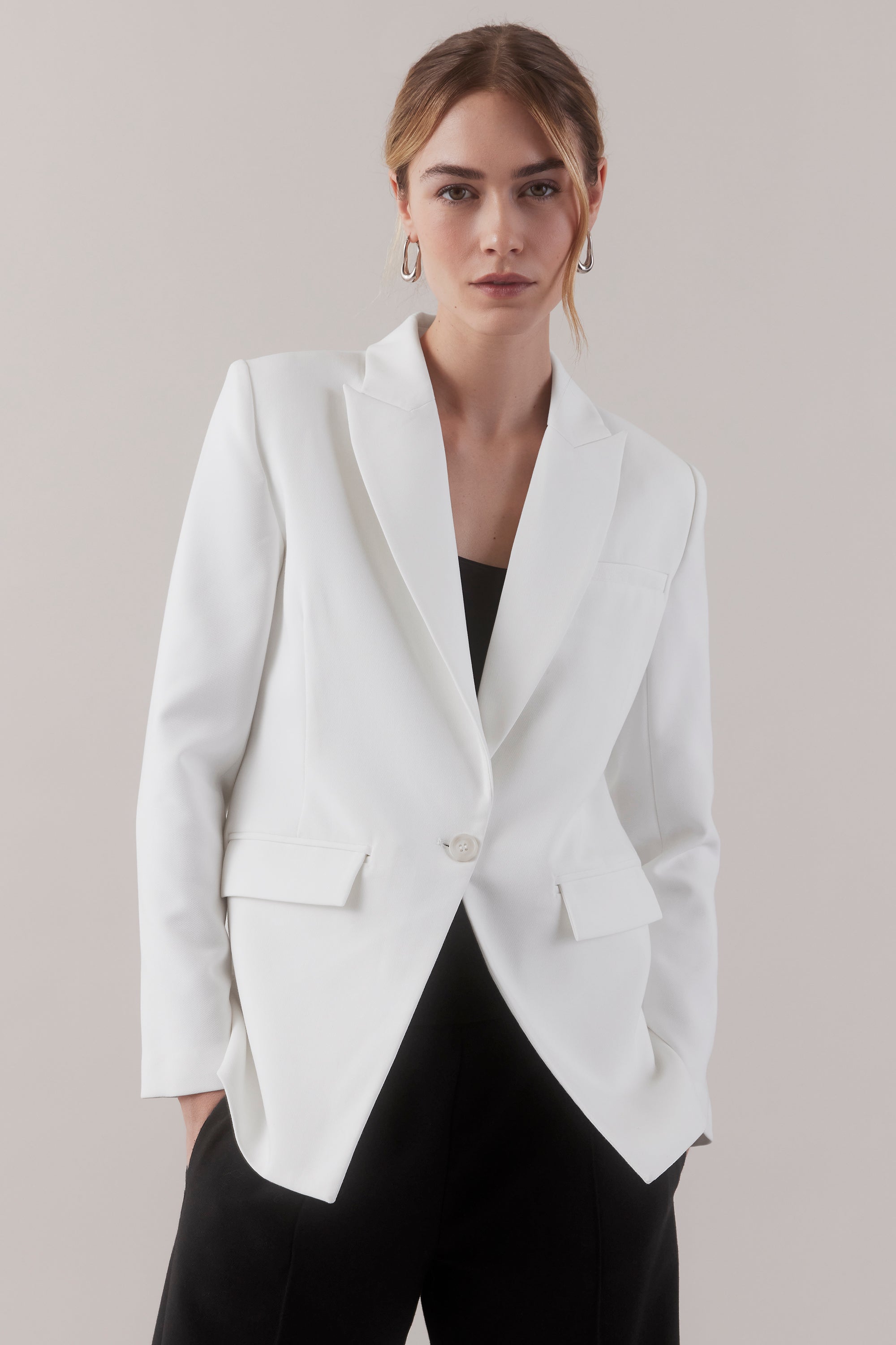 Step into confidence with our chic, tailored lab coat – J.BARBER